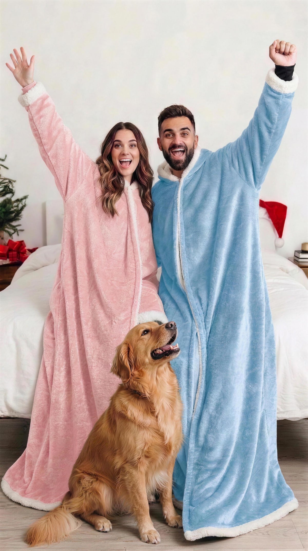 Couple with their dog in Kokoon heated blankets in a festive bedroom